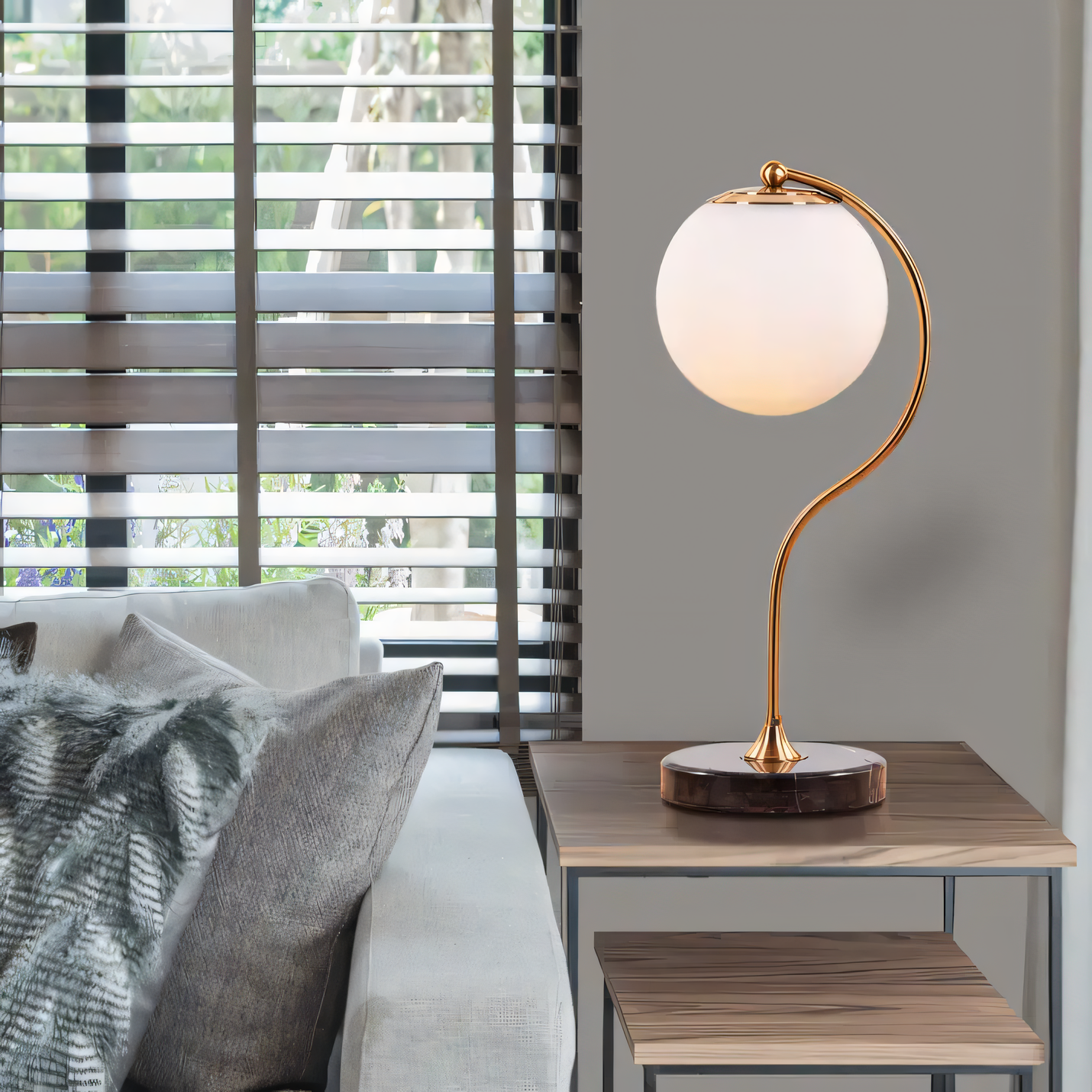 Curved neck table lamp with marble base and gold finish