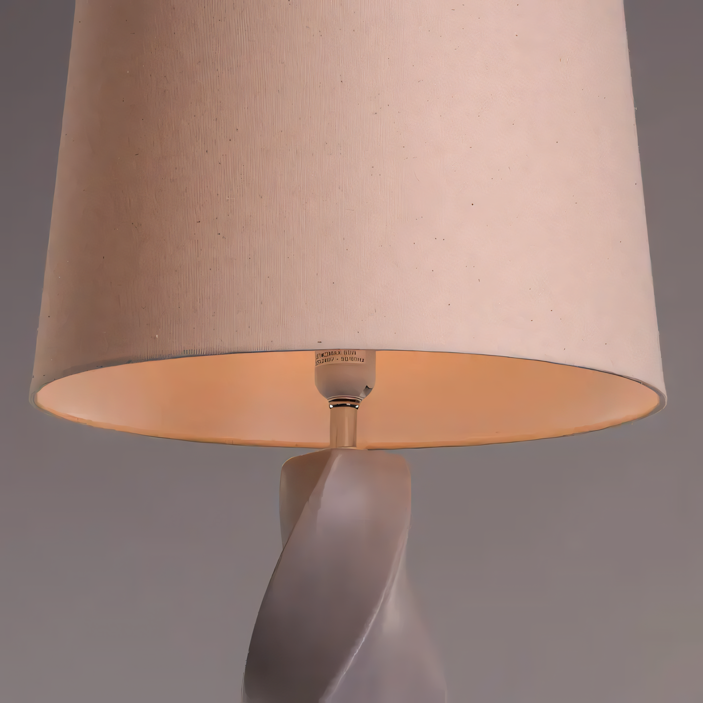 Soft, diffused glow through fabric shade