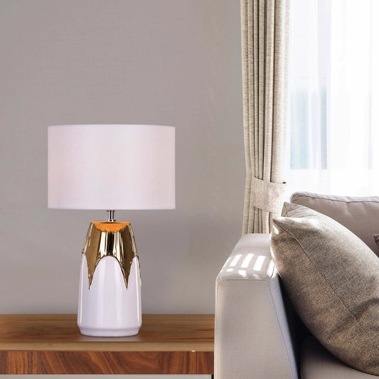 Regal ceramic table lamp with white base and gold accents