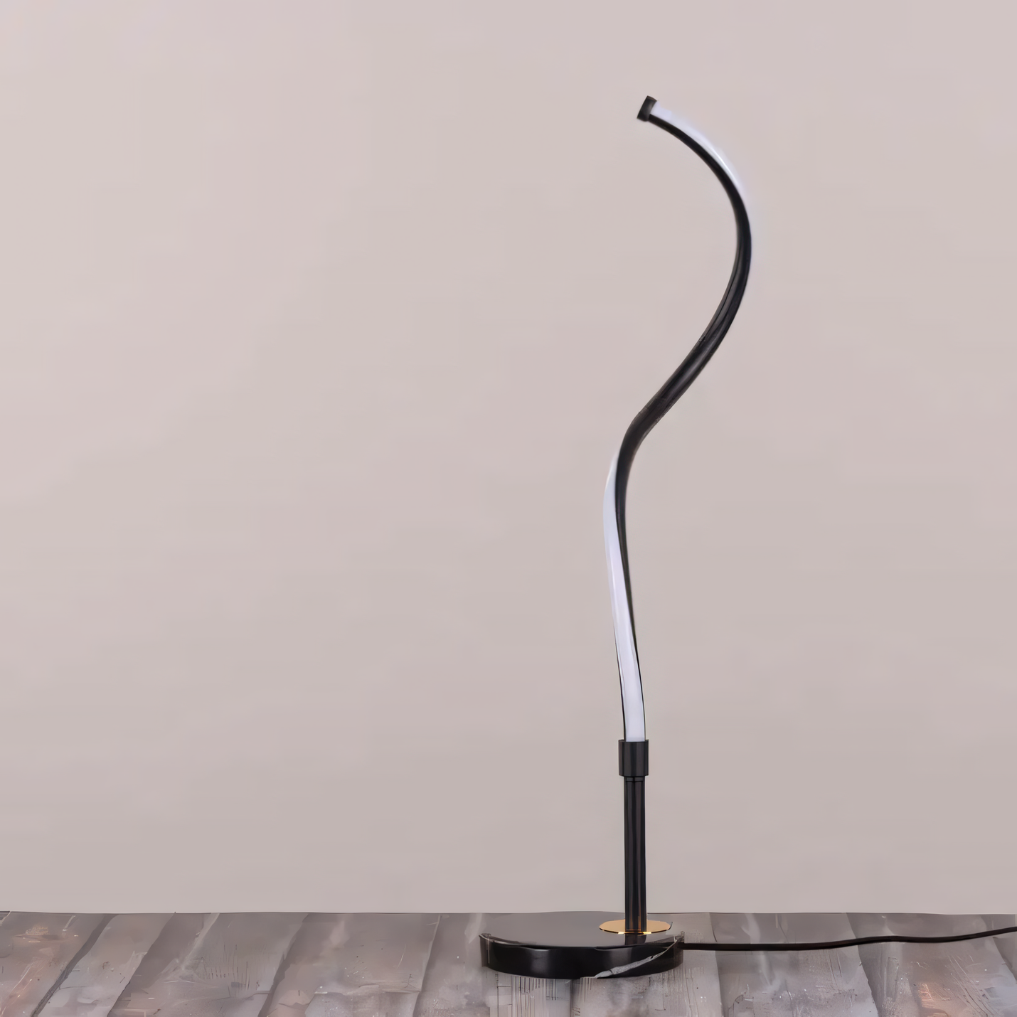 Spiral, snake-inspired design of the Cheat Sheet Marble Table Lamp