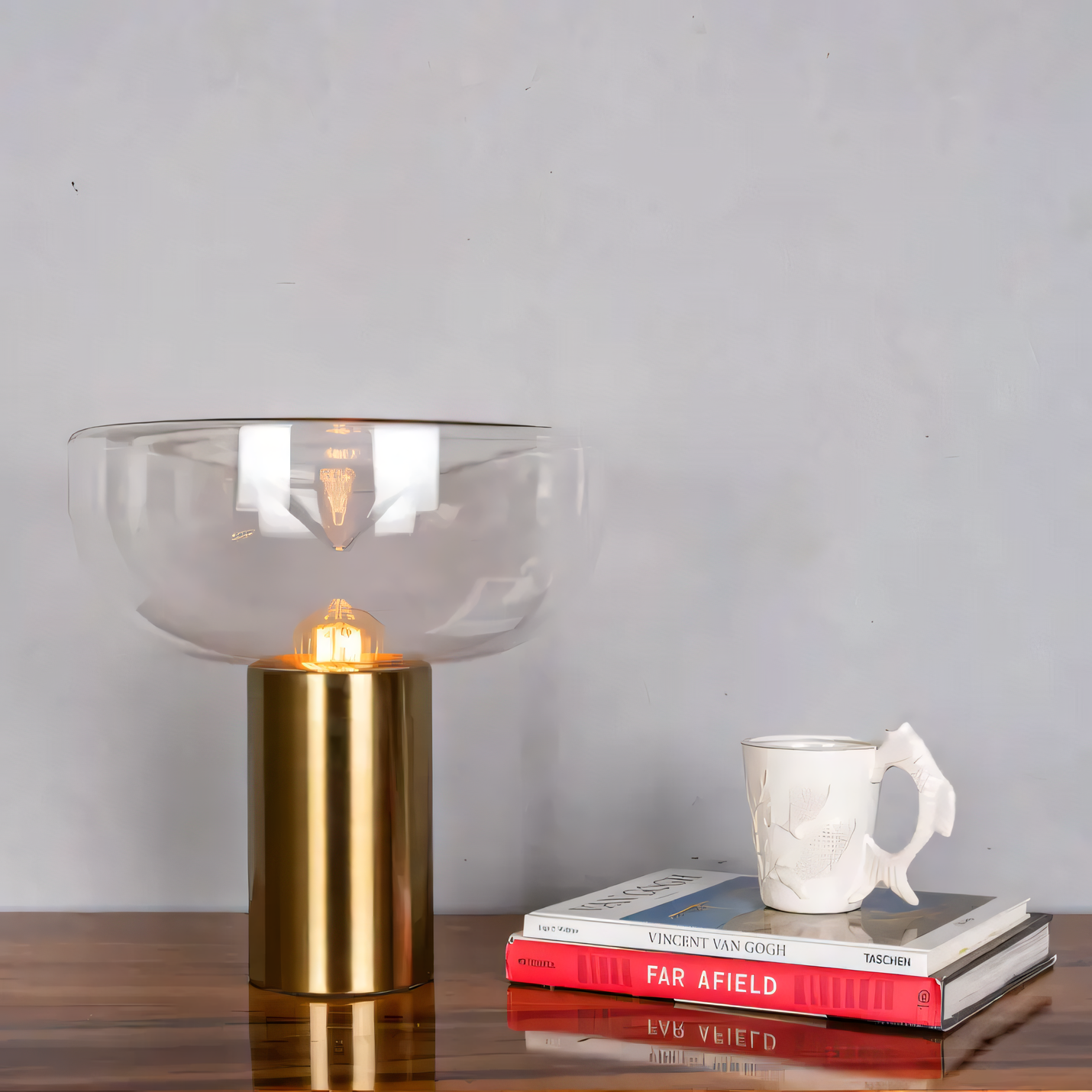 Clear glass table lamp with gold metal base