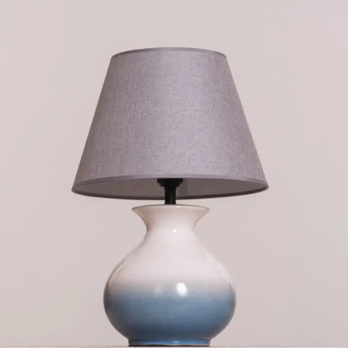 Seaside ambiance from a blue and grey ceramic lamp