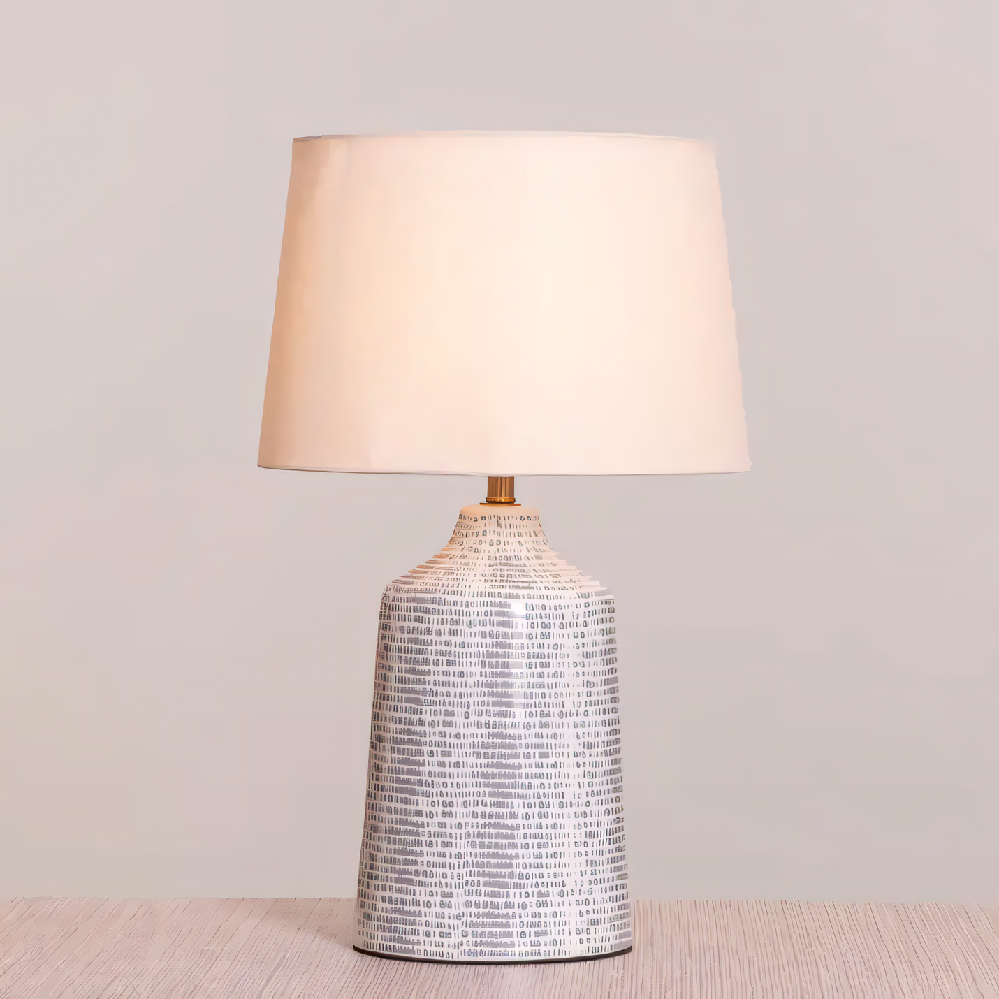 Grey and white ceramic lamp with fabric shade