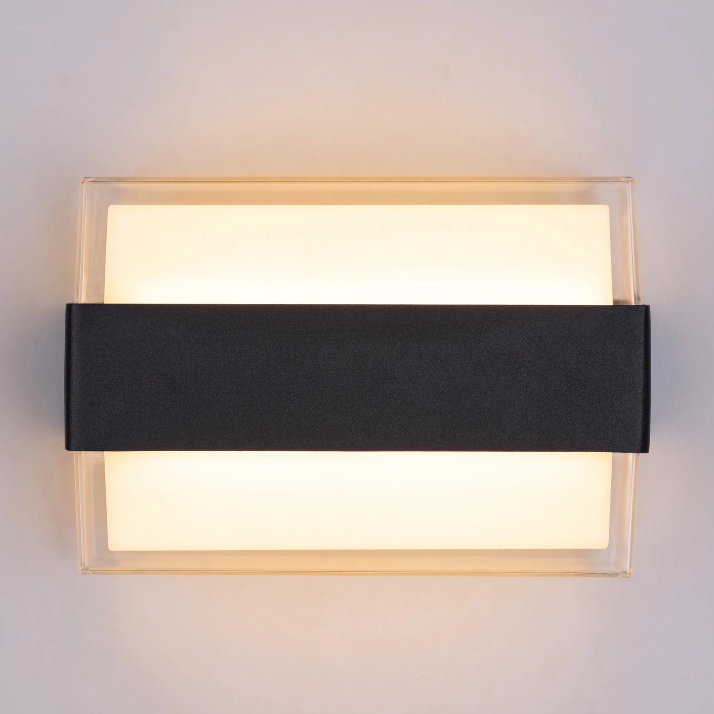 Wonder Indoor/Outdoor Wall Light with IP65 rating, featuring a sleek modern design and energy-efficient illumination for versatile use.