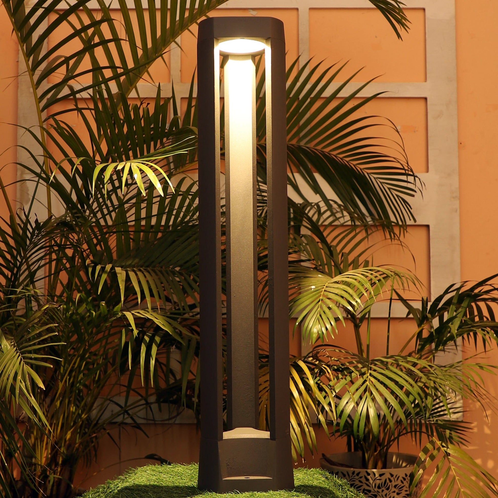 Tri-cut bollard light with modern sculpture-like design