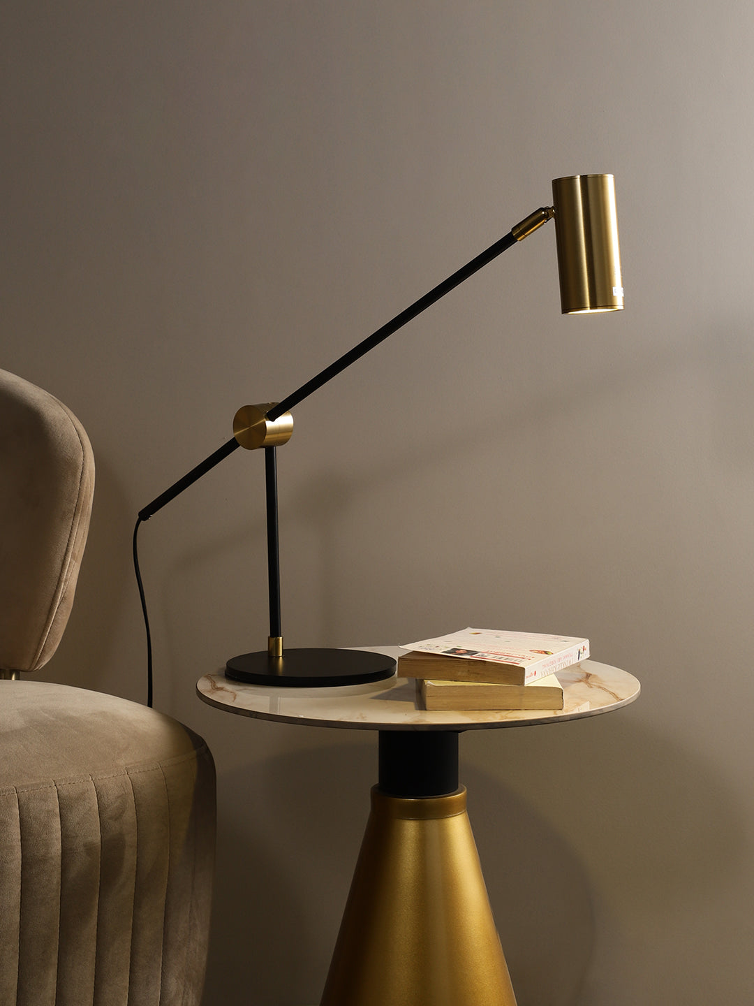 Golden metal table lamp with intricate details