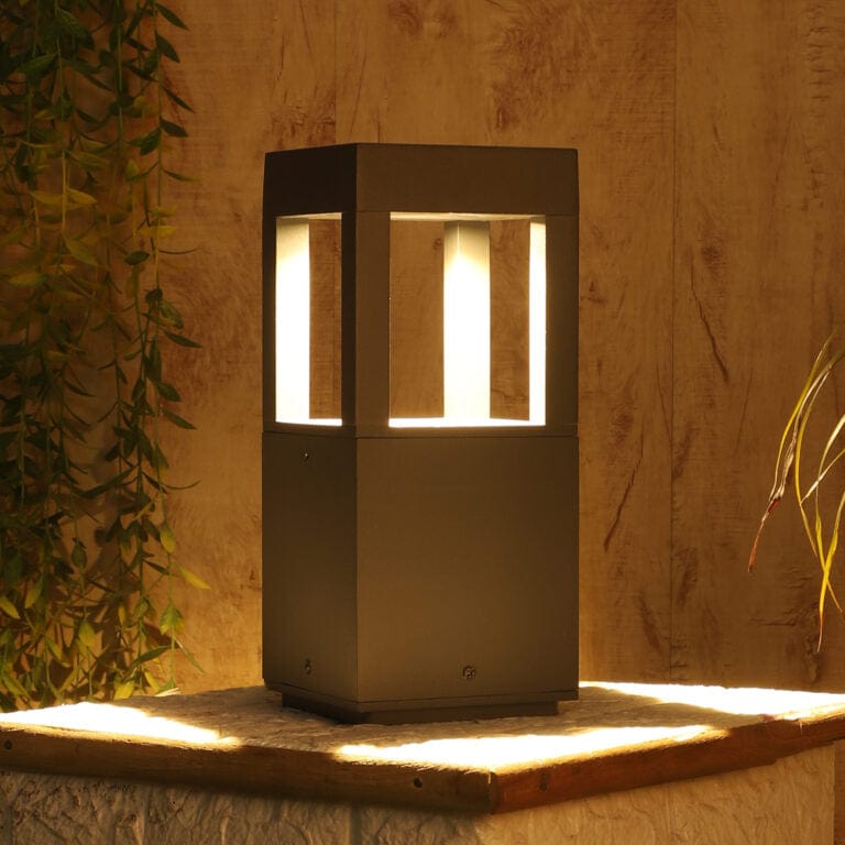 Quad Glare Modern Bollard Garden Light illuminating urban plaza