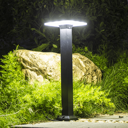 Sleek square bollard light illuminating urban pathways